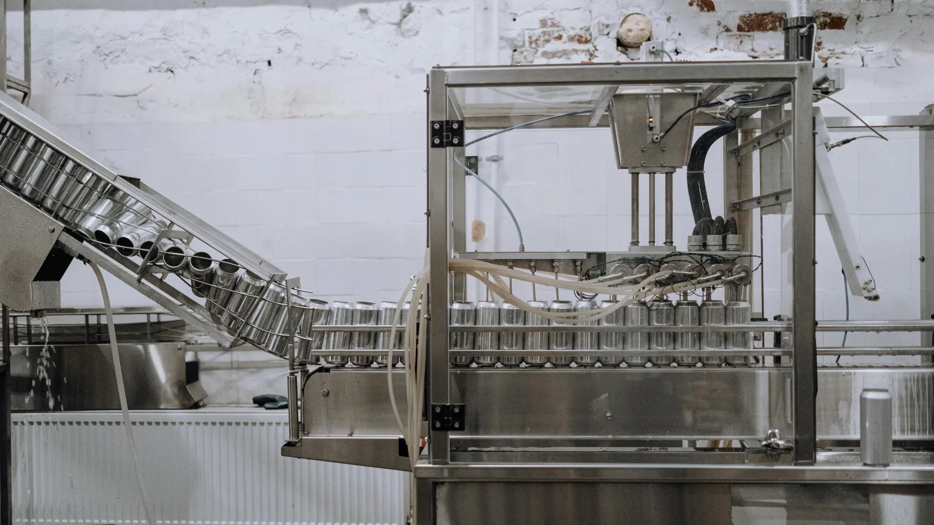 Pharma packaging SPM automating can filling - reducing defects with precision engineering-cnn-robotics.com